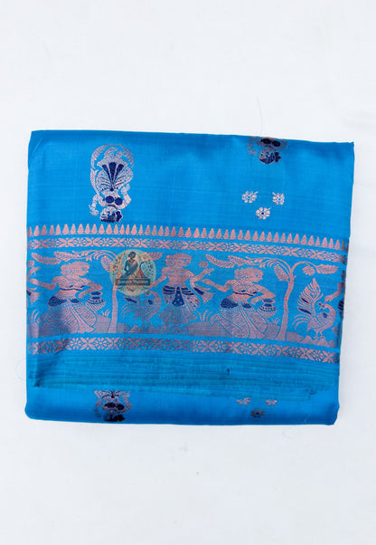 Close up of pale and pink-toned woven motifs on the teal blue Swarnachari silk saree body