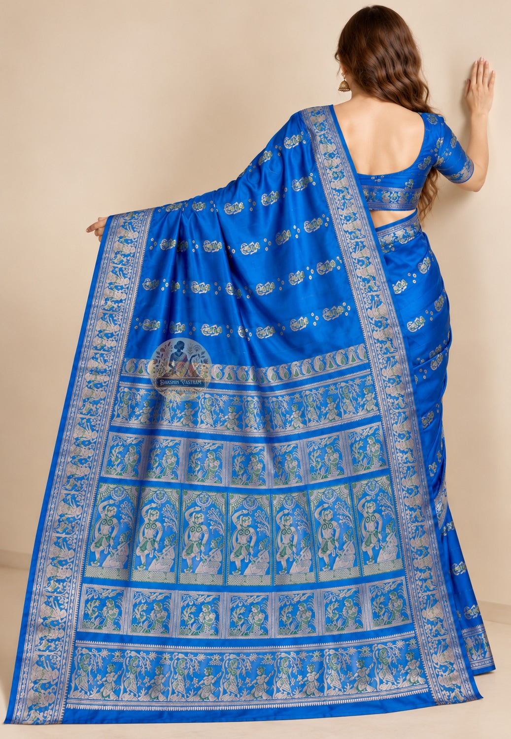 Rear view of blue Swarnachari saree showing the shoulder drape and patterned pallu
