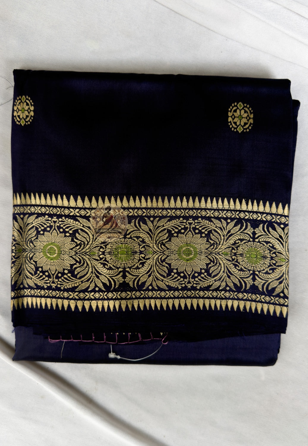 Close-up of celestial archer butis and floral medallions woven into border of Baluchari Silk Saree, Bengal handloom