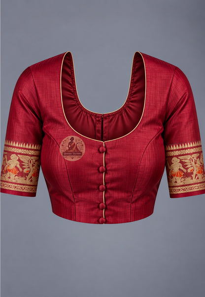 Blouse paired with red Swarnachari silk saree, featuring gold-toned motifs and patterned sleeve borders
