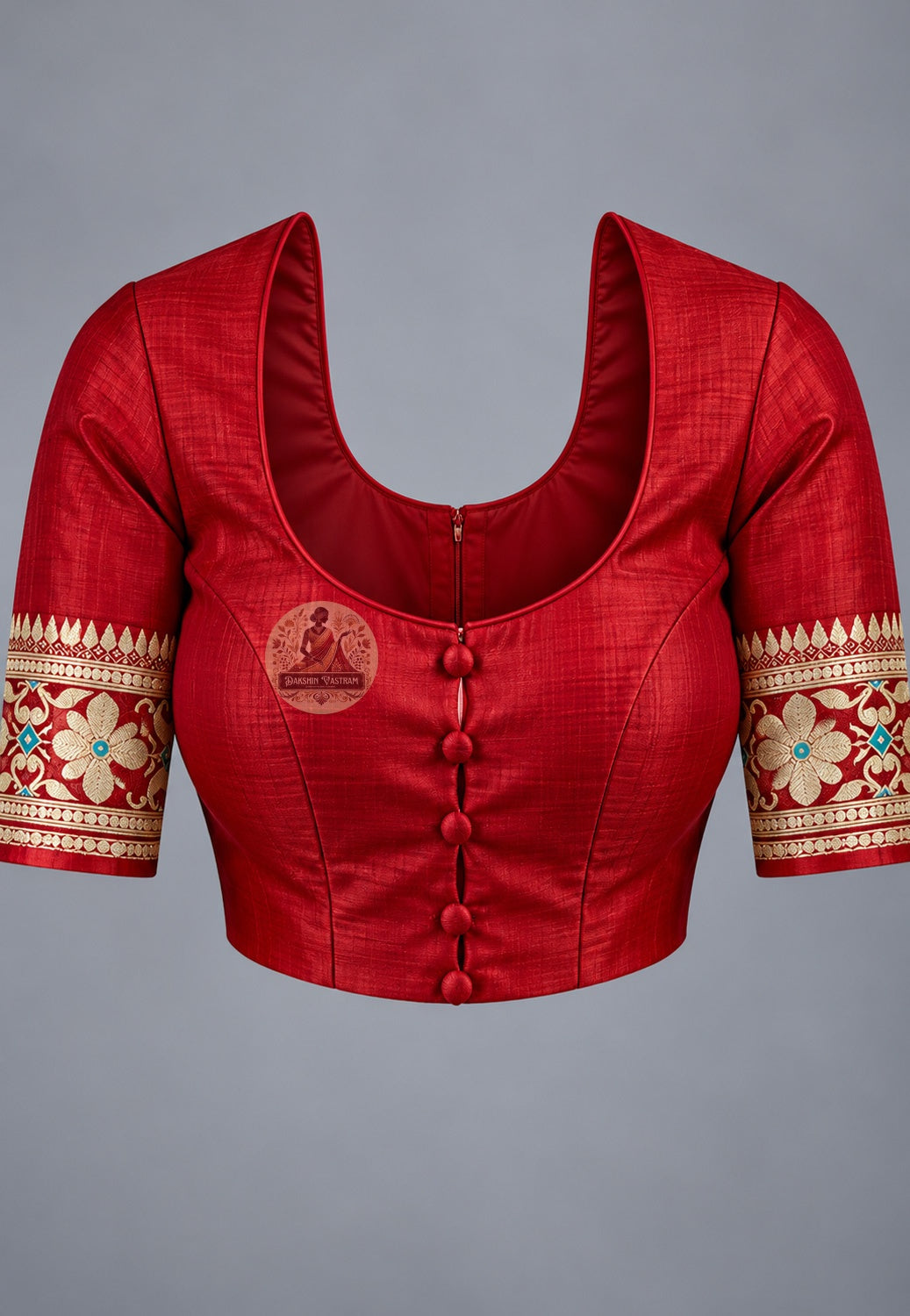 Blouse paired with maroon Baluchari silk saree, featuring a pale floral-patterned sleeve border