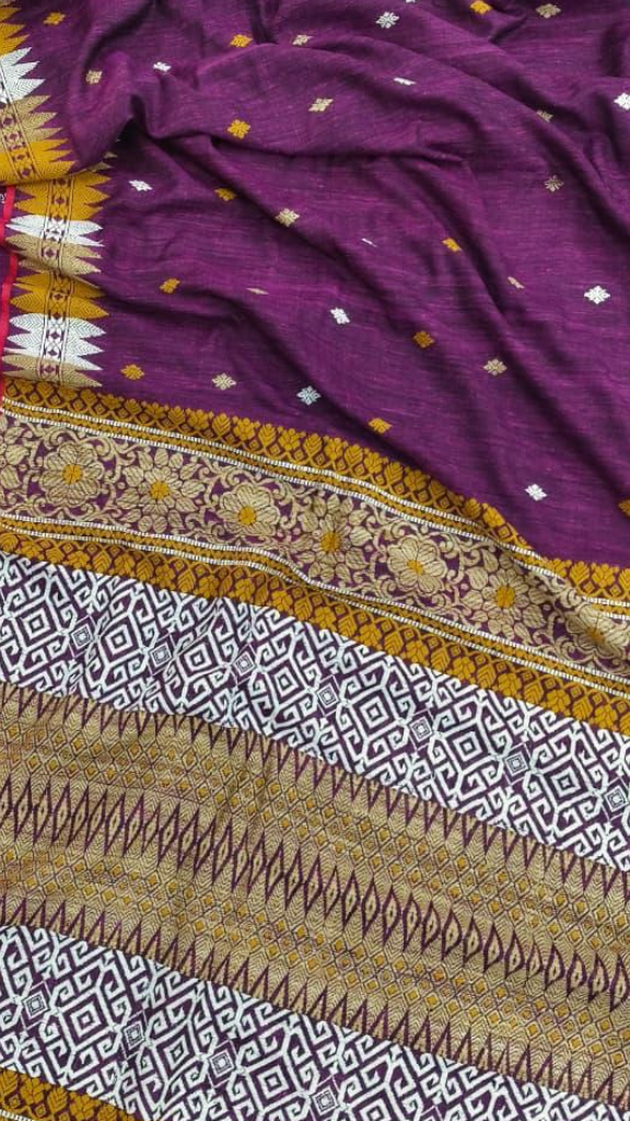 Flat lay of pure Eri silk saree with blouse piece, handwoven in Assam, natural matte texture by Dakshin Vastram