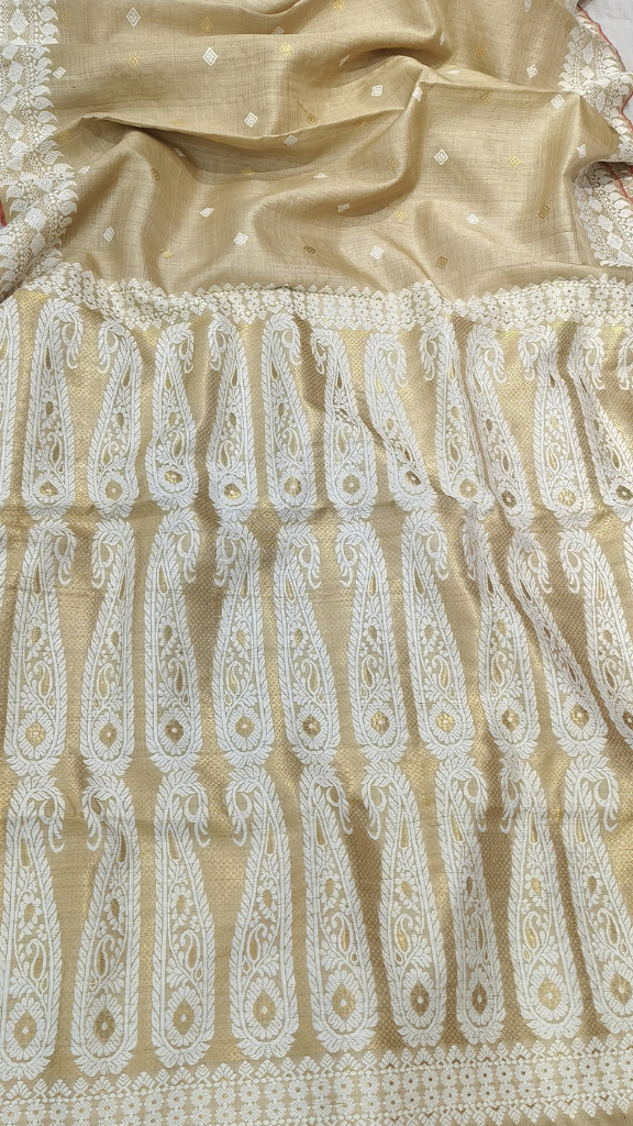 Rear view of Assam handloom Muga silk saree highlighting its golden-beige fabric and diamond motifs.