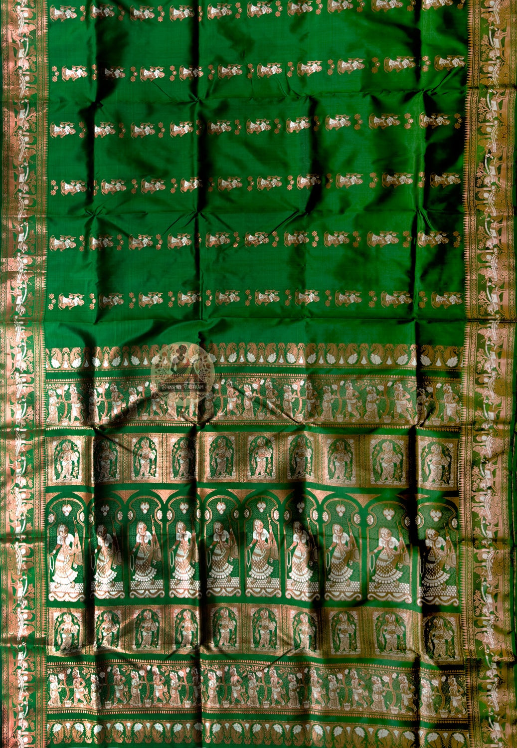 Side view of Swarnachari handloom silk saree showing fine golden zari detail border and naturally warm pure silk drape, West Bengal pit-loom weave
