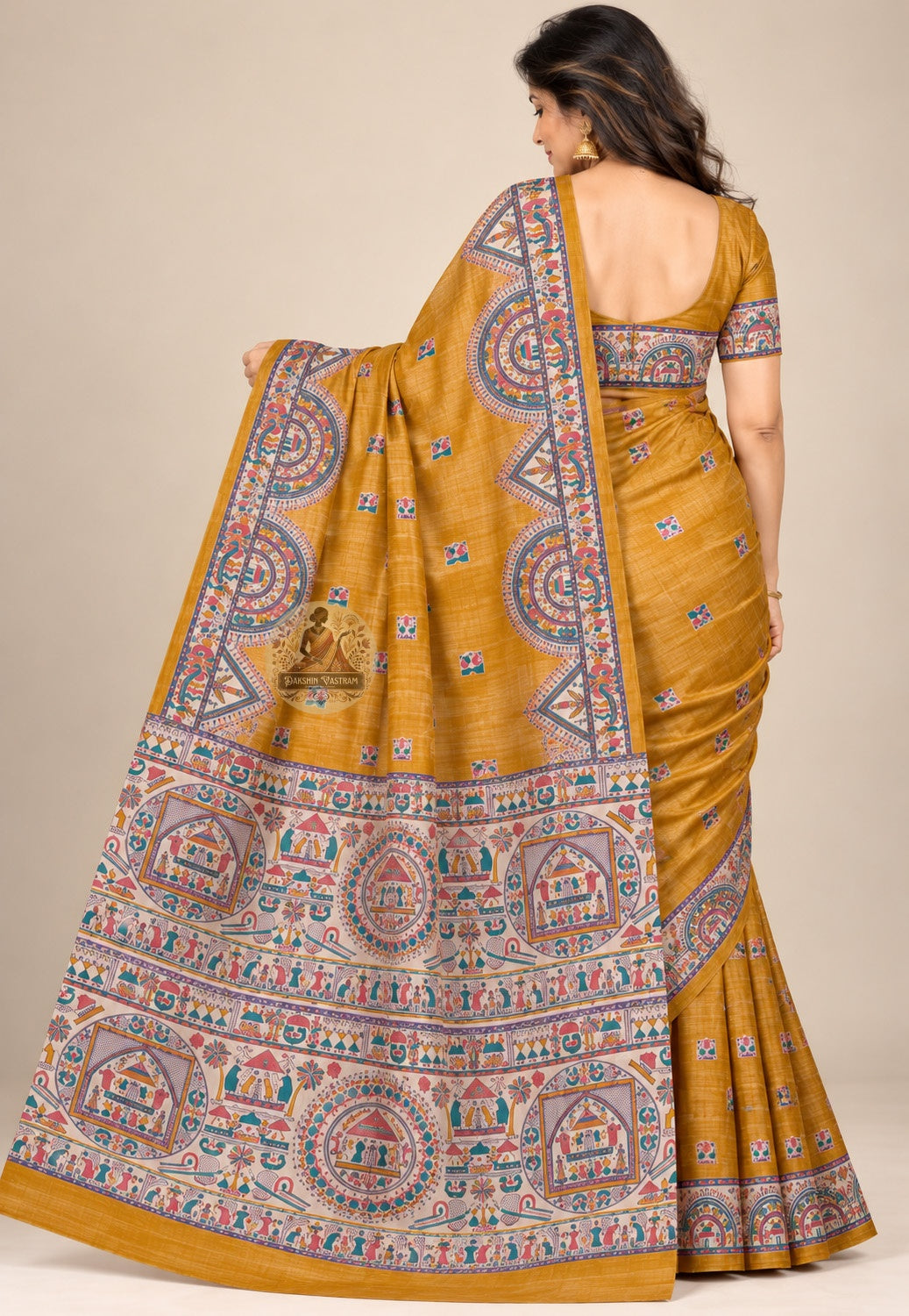 Side view of mustard Ghicha Tussar silk saree showing the pleated drape and rounded decorative border panels