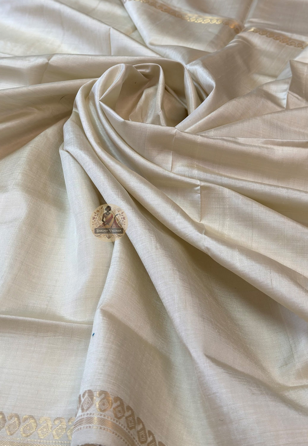 Close-up of Bishnupur Katan silk pallu with hand-woven heritage motifs placed with the care of a weaver who knows what they are making will be kept — drawn from Bishnupur's centuries of artistic memory