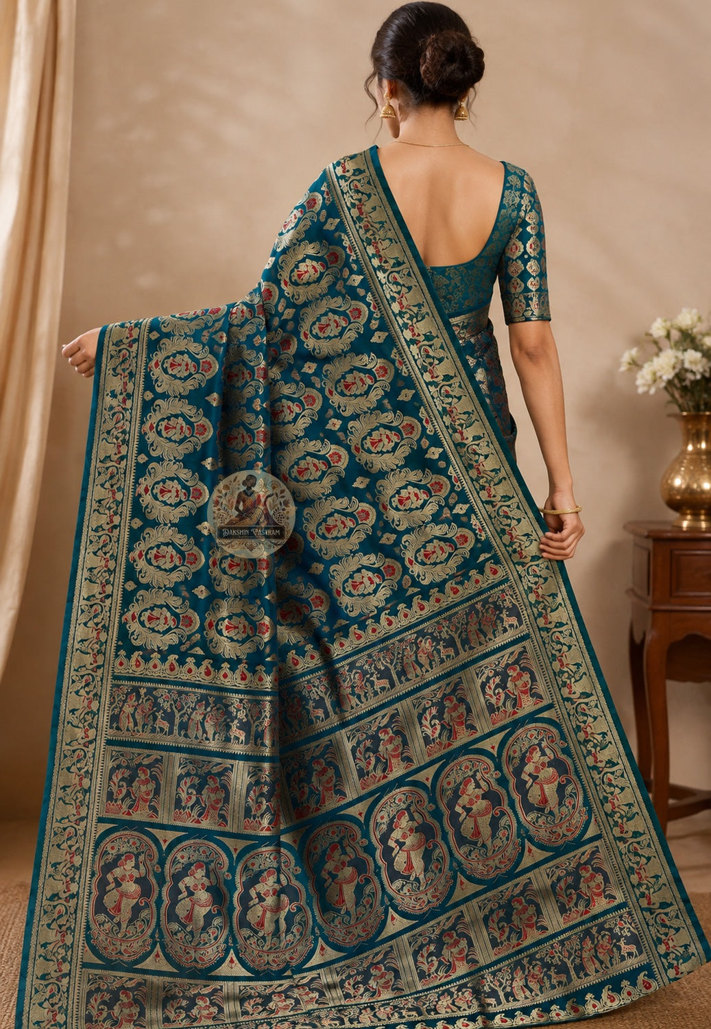 Side view of handwoven Swarnachari silk saree showing golden zari pallu fall and border detail