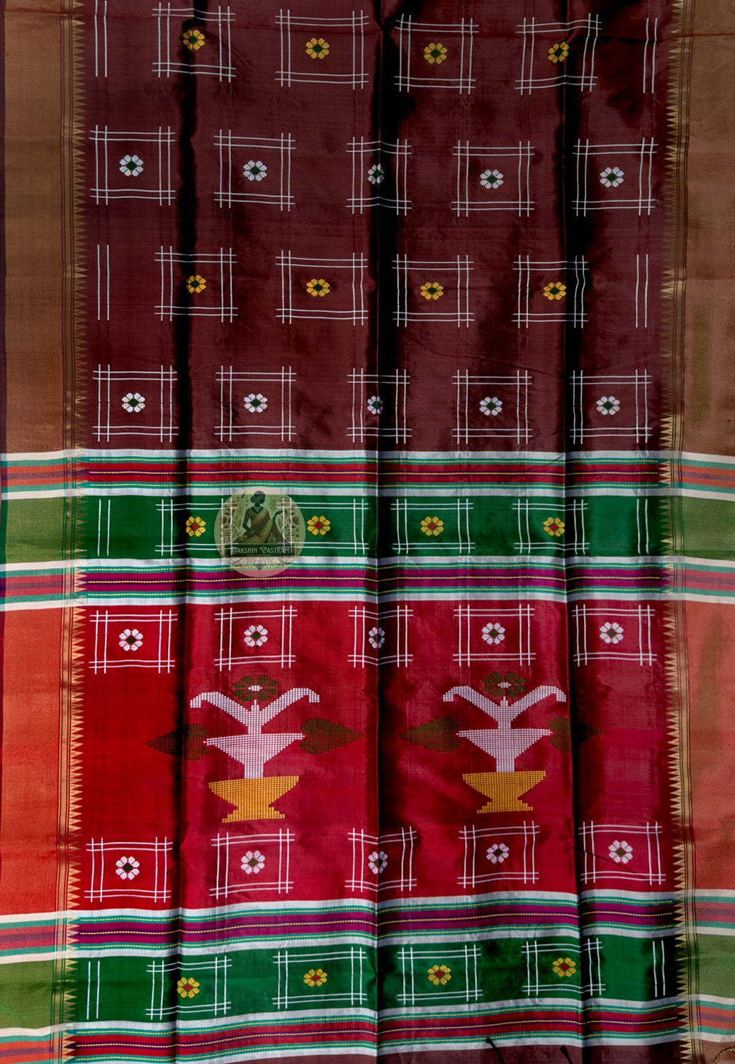 Close-up of Bishnupur Katan silk wedding saree weave showing tightly woven pure silk texture and traditional Bengal buti motifs formed in the weave