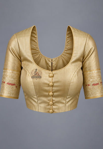 Blouse paired with beige gold Swarnachari silk saree in a coordinating warm neutral shade