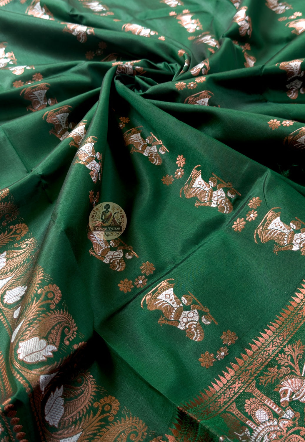 Side view of Swarnachari pure silk close-read saree displaying natural drape and golden zari luminescence with detailed buti motifs throughout silk body for wedding occasions