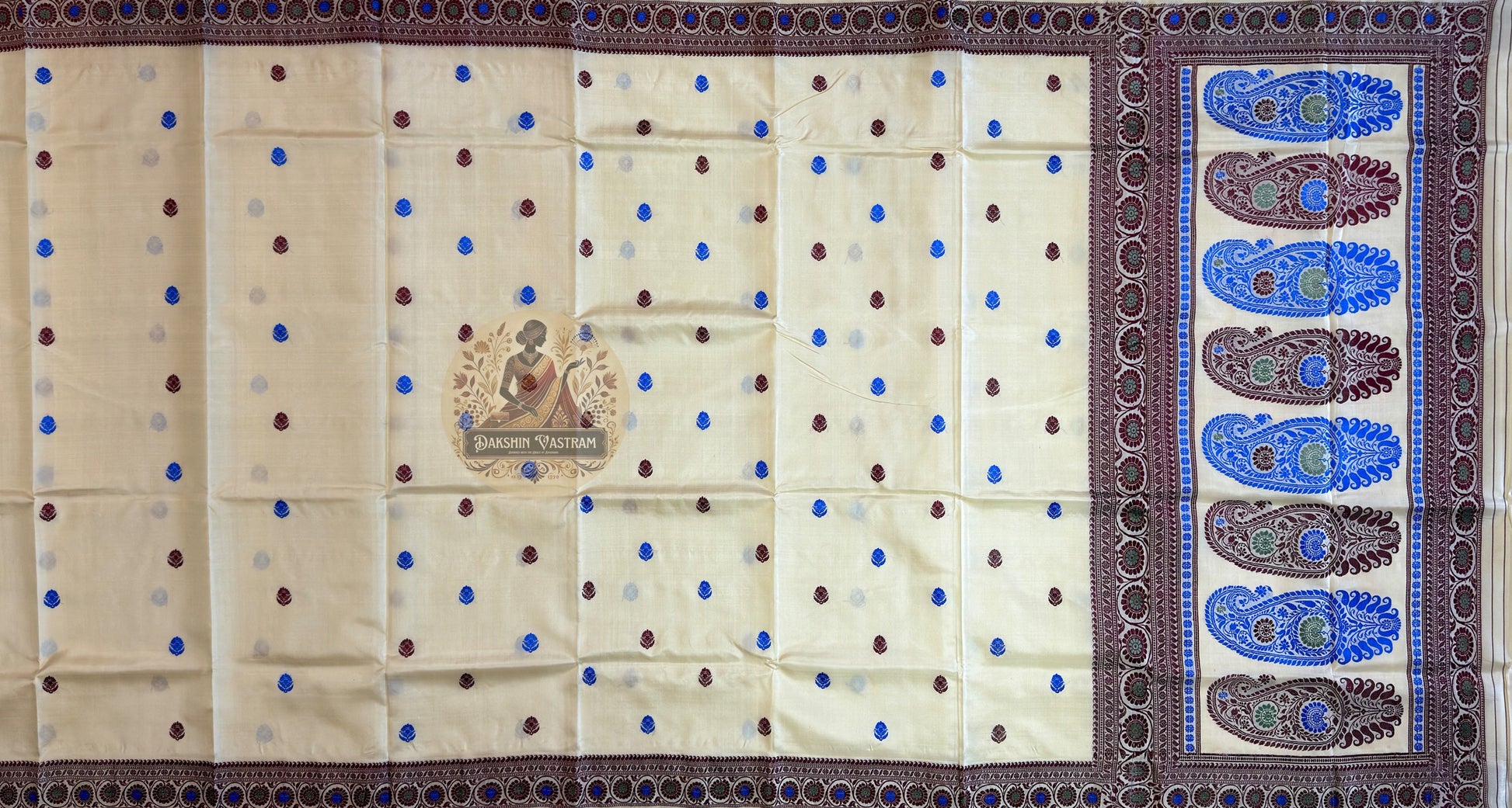 Macro close-up of individual hand-woven mythological motif on masterpiece Baluchari Silk Saree by Dakshin Vastram, each figure woven with devotion thread by thread on the handloom