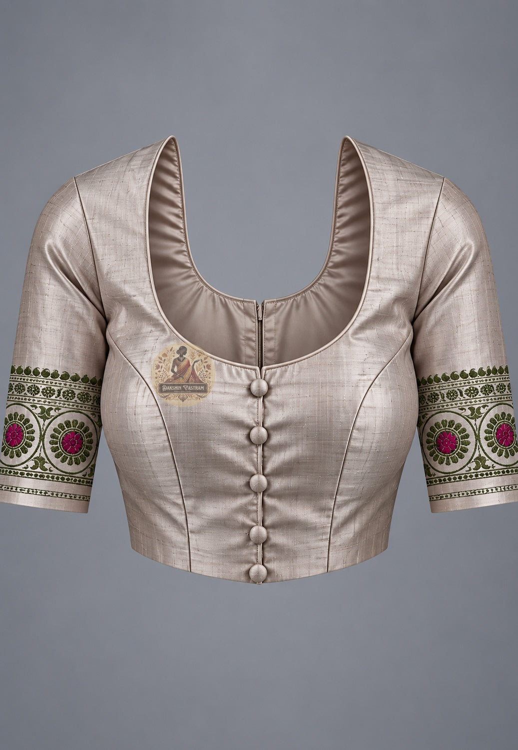 Blouse paired with taupe Baluchari silk saree, featuring pink motifs and patterned sleeve borders