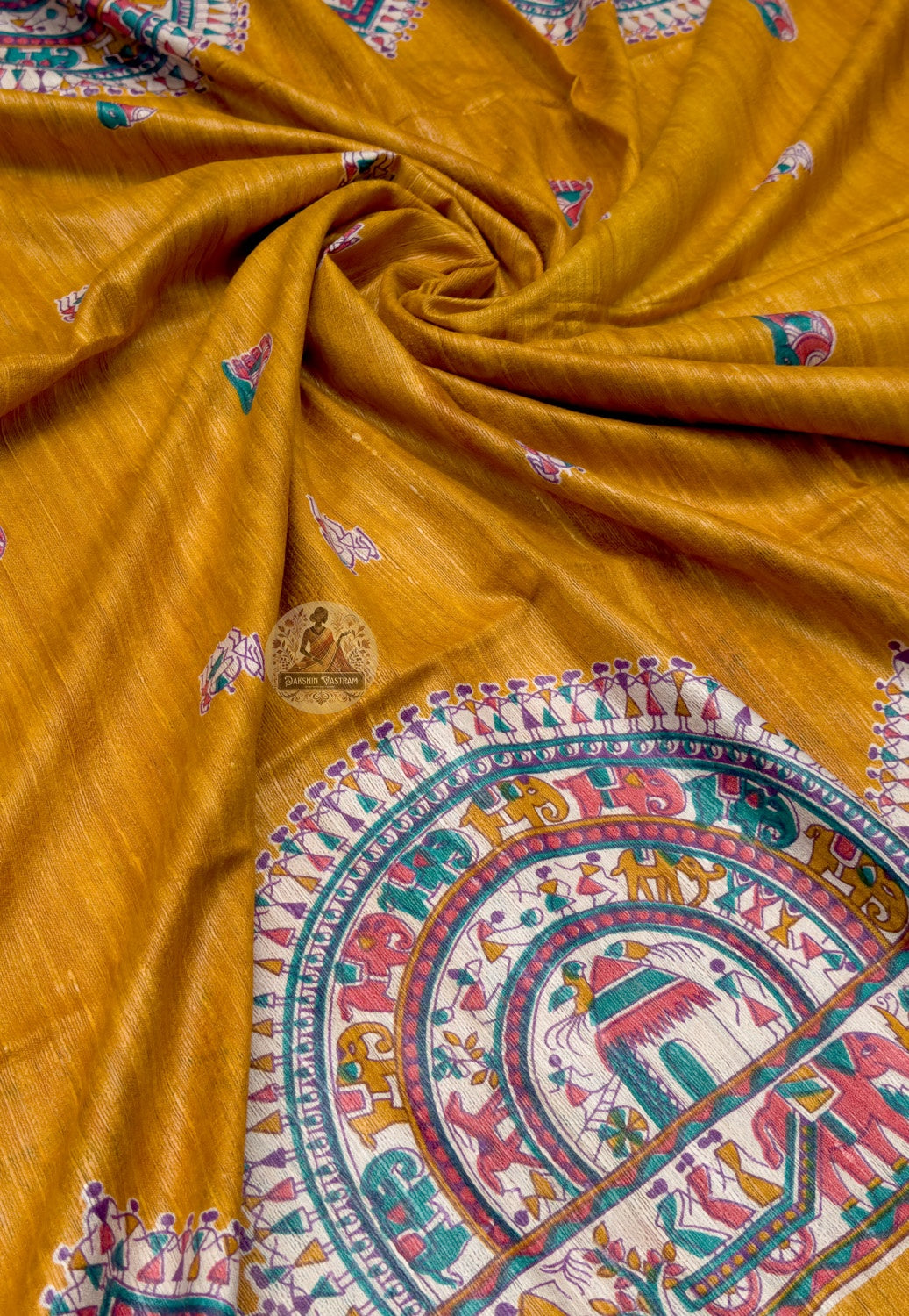 Full saree view of mustard Ghicha Tussar silk saree with multicoloured borders and a detailed pictorial pallu