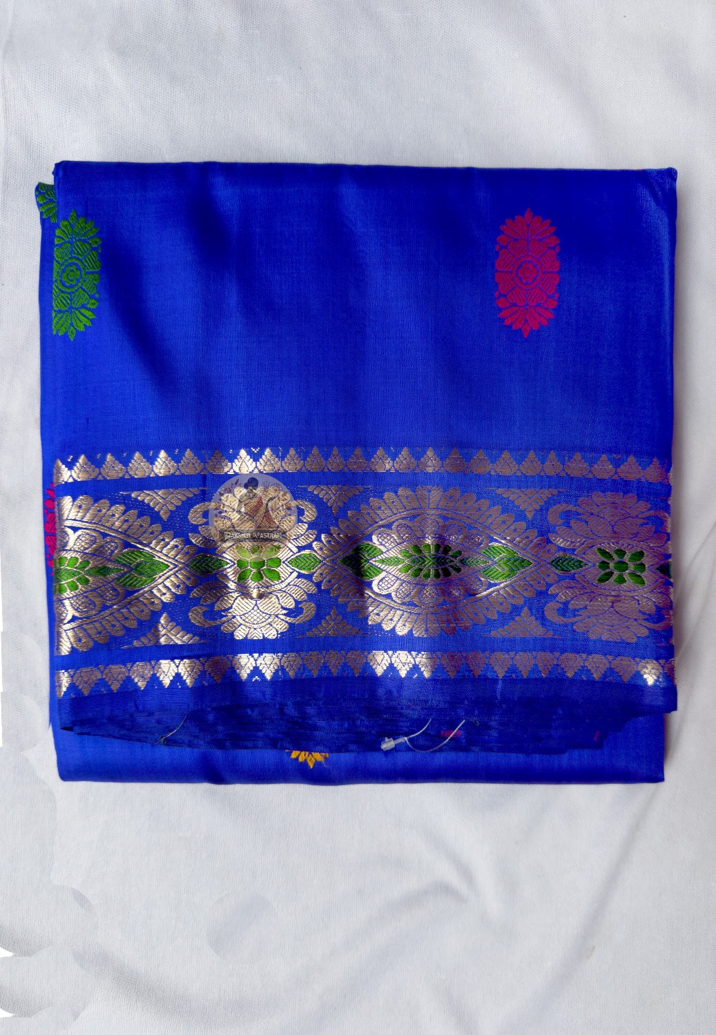 Full flat-lay of premium Swarnachari pure silk saree with golden zari portrait border, clearly rendered narrative pallu, precisely drawn buti field, and matching unstitched blouse piece, West Bengal handloom