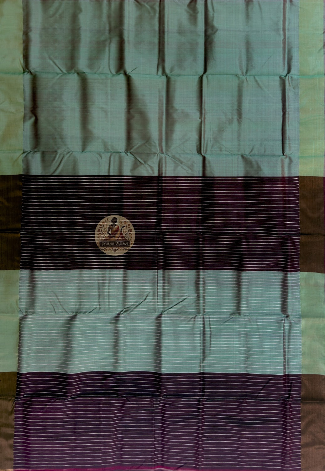 Close-up of Bishnupur Katan silk pallu with hand-woven heritage motifs placed with the patience of a weaver in no hurry, drawn from centuries of Bishnupur's artistic and temple tradition in Bengal