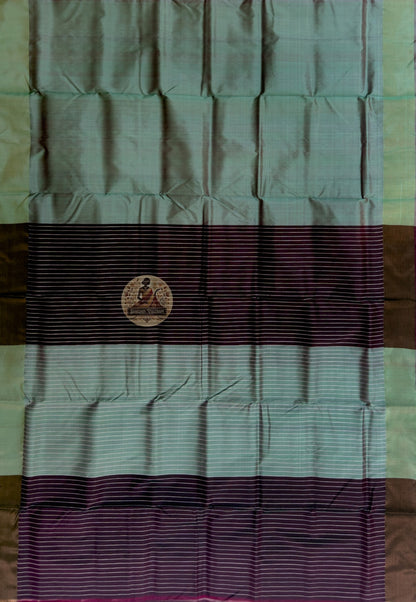 Close-up of Bishnupur Katan silk pallu with hand-woven heritage motifs placed with the patience of a weaver in no hurry, drawn from centuries of Bishnupur's artistic and temple tradition in Bengal