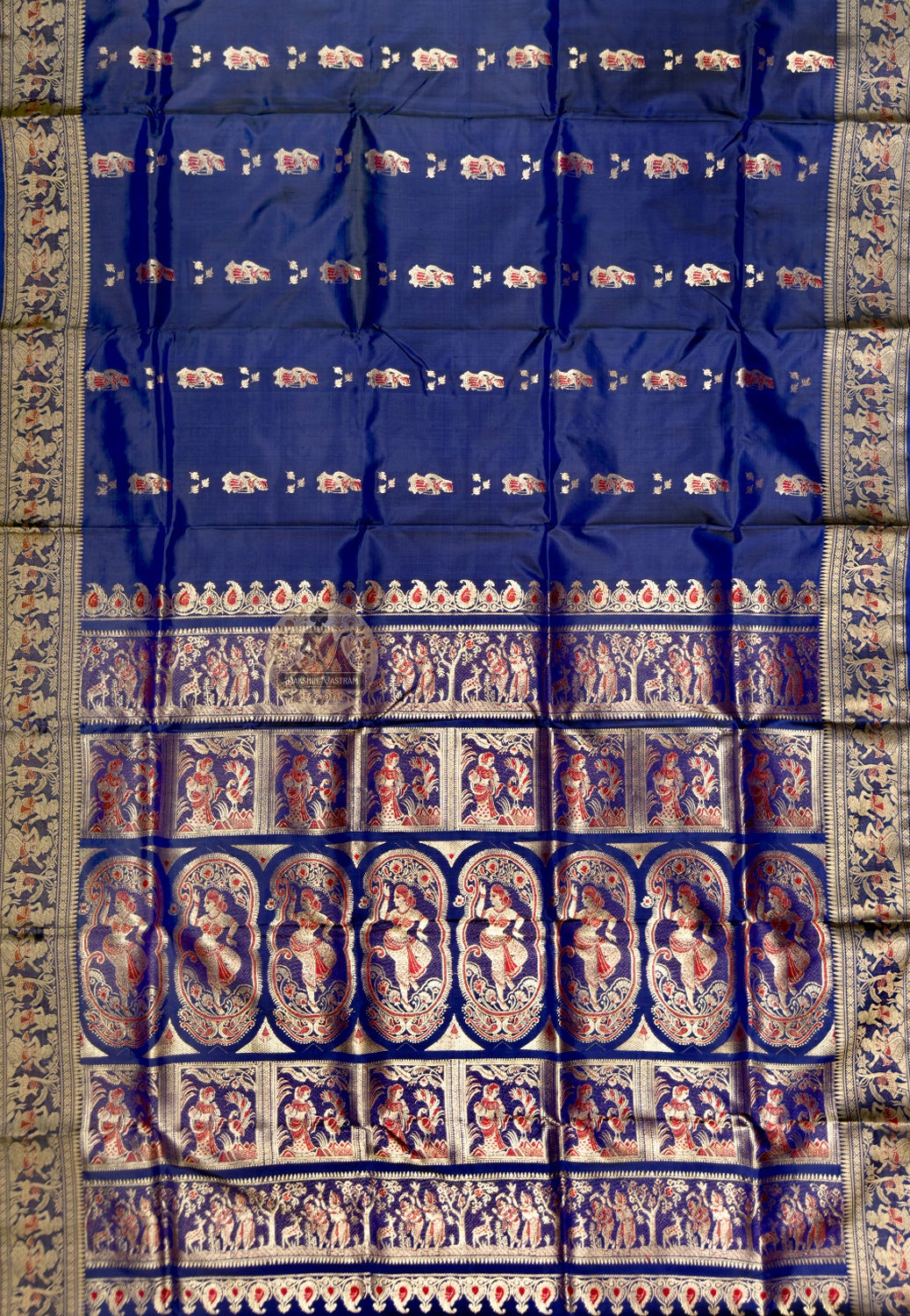 Full saree view of royal blue Swarnachari silk saree with repeating motifs and an elaborate pallu