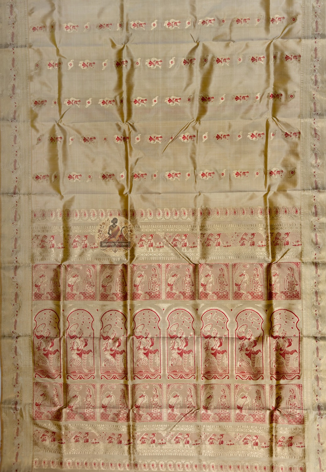Full saree view of beige gold Swarnachari silk saree with scattered red motifs and a figurative pallu