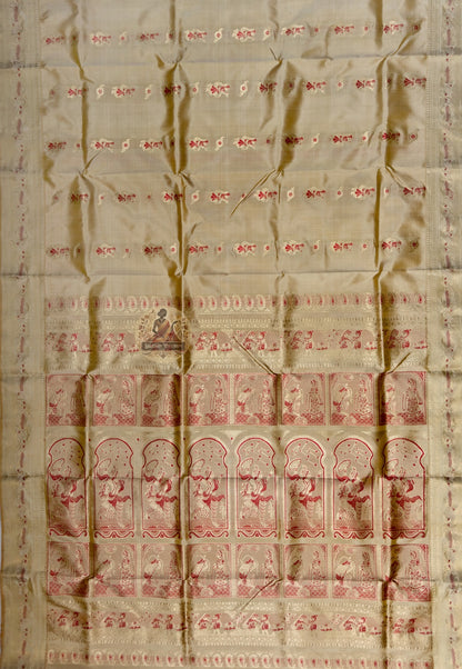 Full saree view of beige gold Swarnachari silk saree with scattered red motifs and a figurative pallu