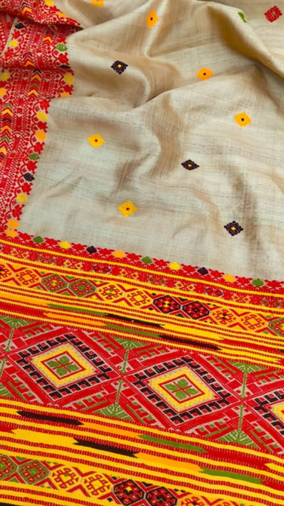 Close-up of running blouse fabric from Pure Muga Silk Saree set, featuring coordinating natural golden Muga silk with handwoven texture and warm evolving finish