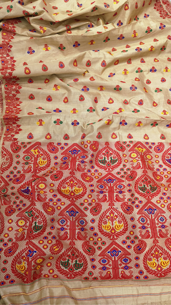 Muga silk saree from Sualkuchi worn at a Karva Chauth and Poila Boishakh celebration — authentic handloom delivered to Leeds, Newcastle, Liverpool and worldwide