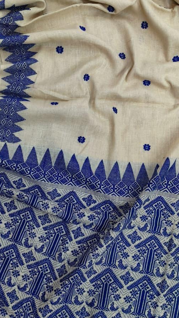 Full-length flat lay of Dakshin Vastram Eri Silk Saree, handloom Assam silk with matte finish, natural drape and woven border