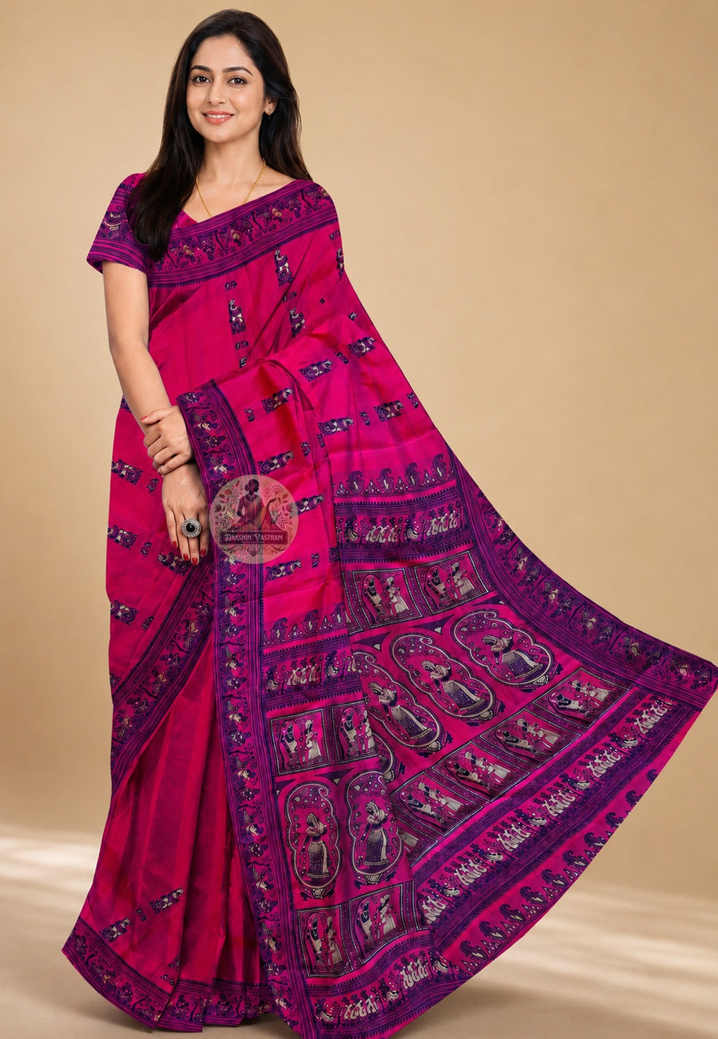 Side view of Rani Pink Baluchari Silk Saree showing the graceful luminous fall of handwoven pure silk in rani pink with navy Baluchari buti motifs repeating across the body in quiet, confident rhythm