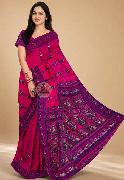 Side view of Rani Pink Baluchari Silk Saree showing the graceful luminous fall of handwoven pure silk in rani pink with navy Baluchari buti motifs repeating across the body in quiet, confident rhythm