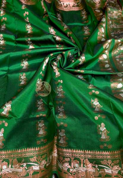 Close-up of Swarnachari silk saree pallu showing finely resolved hand-woven golden zari detail panel with Bengal royal court and temple sculpture motifs rewarding close inspection