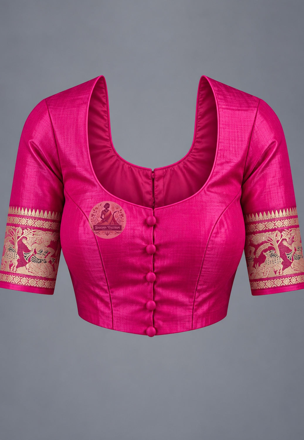 Blouse paired with rani pink Swarnachari silk saree, featuring patterned sleeve borders