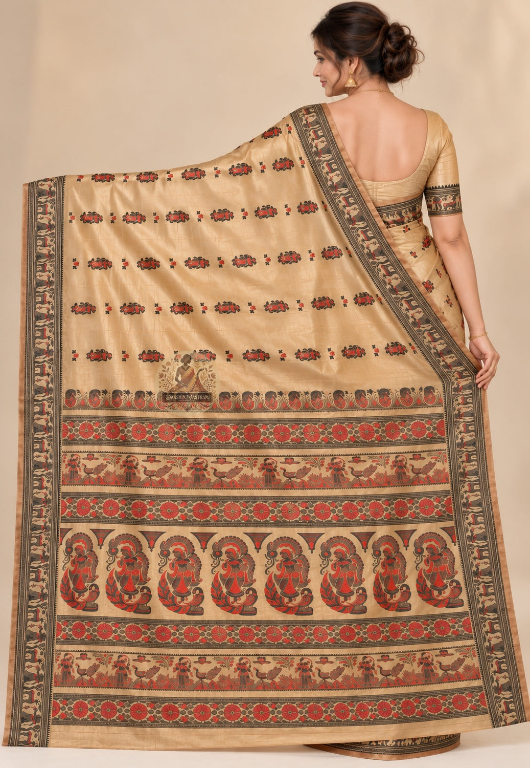 Side view of beige Baluchari silk saree showing the drape and contrasting dark border