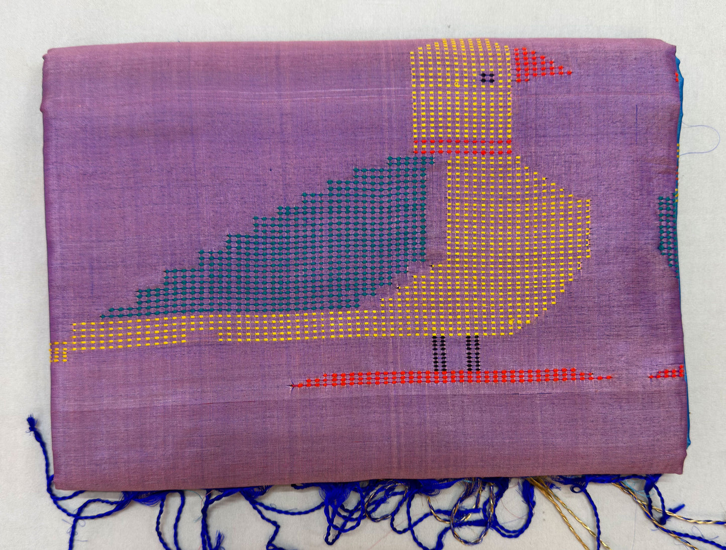 Full flat-lay of handloom Bishnupur Katan silk saree with classical weave, considered border, clean buti field, and matching unstitched Katan silk blouse piece, West Bengal classical arts heritage