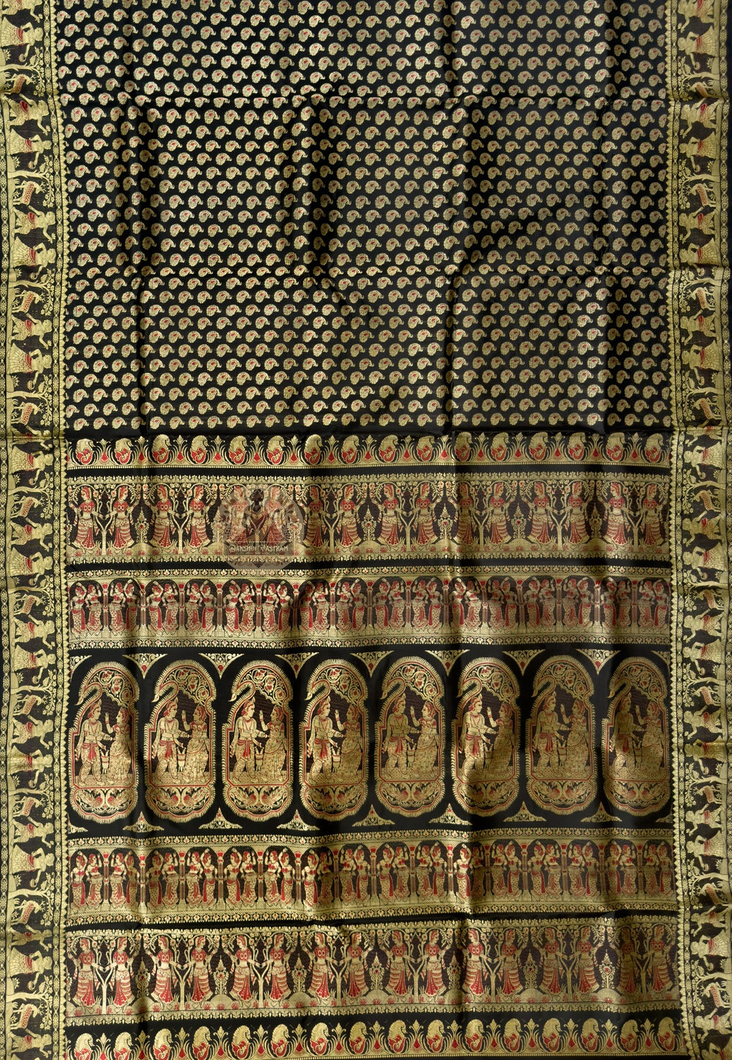 Full saree view of black Baluchari silk saree with patterned body, contrasting borders and figurative pallu