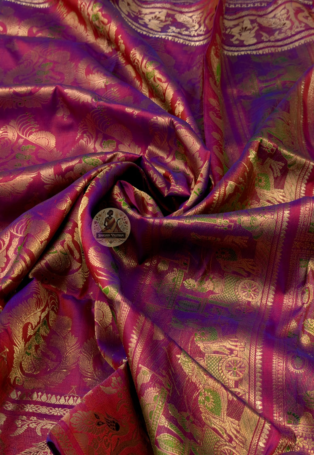 Rear view of Swarnachari silk saree displaying golden zari pallu with hand-woven Bengal temple and Ramayana cartography compositions marking the visual geography of a tradition