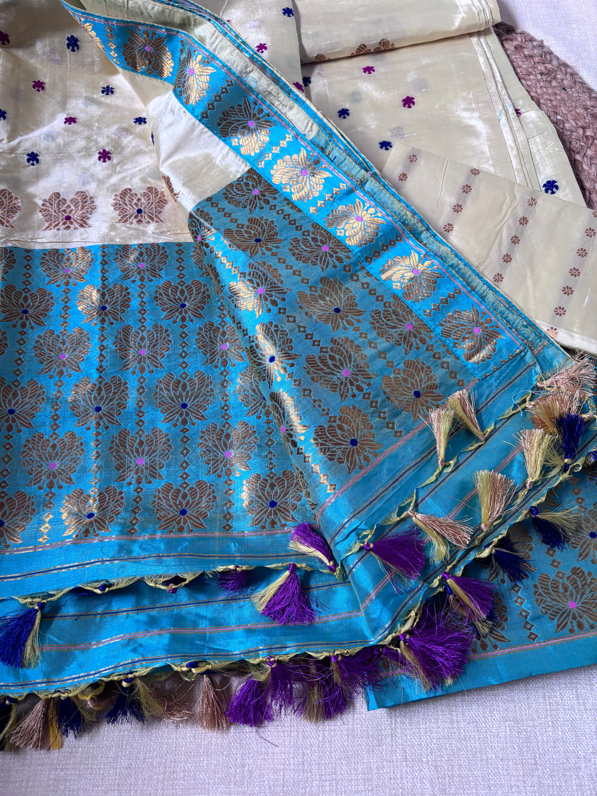 Side view of Paat Mekhela Chador showing Diwali gala drape and fish bamboo supplementary weft handloom border Sualkuchi Assam mulberry silk
