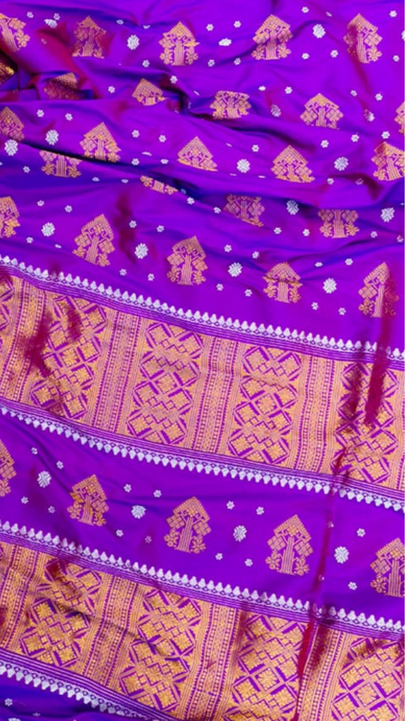 Close-up of copper zari thread handwoven into Assam Mulberry Silk Saree, revealing intricate artisan metallic craftsmanship and traditional Northeast India textile heritage