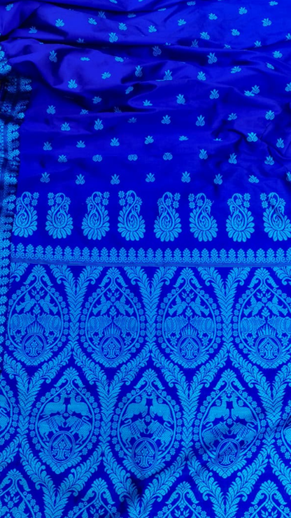 Close-up of hand thread work embroidery on Assam Mulberry Silk Saree, revealing intricate artisan craftsmanship and traditional Northeast India textile patterns