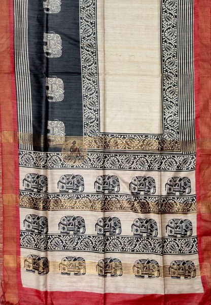 Full saree view of cream Ghicha Tussar silk saree with black patterned bands and red outer edges