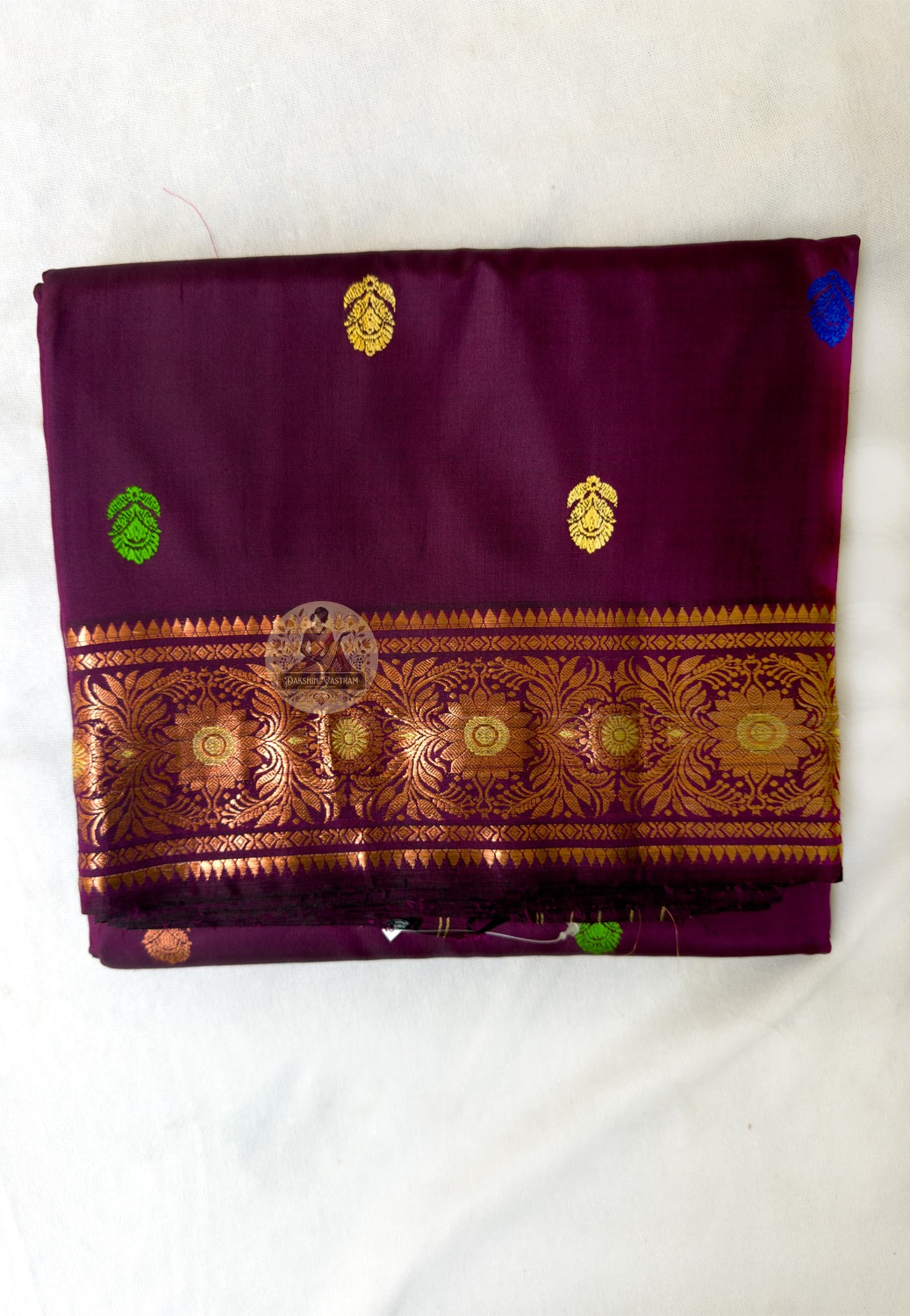 Full flat-lay of premium Swarnachari pure silk saree with illuminating golden zari border, depth-revealing narrative pallu, luminous buti field, and matching unstitched blouse piece, West Bengal handloom