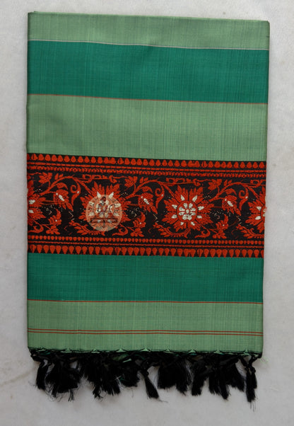 Close-up of terminal panel of Bishnupur Baluchari silk legacy stole showing dense Bankura master weaver narrative motif detail preserved across decades of wear