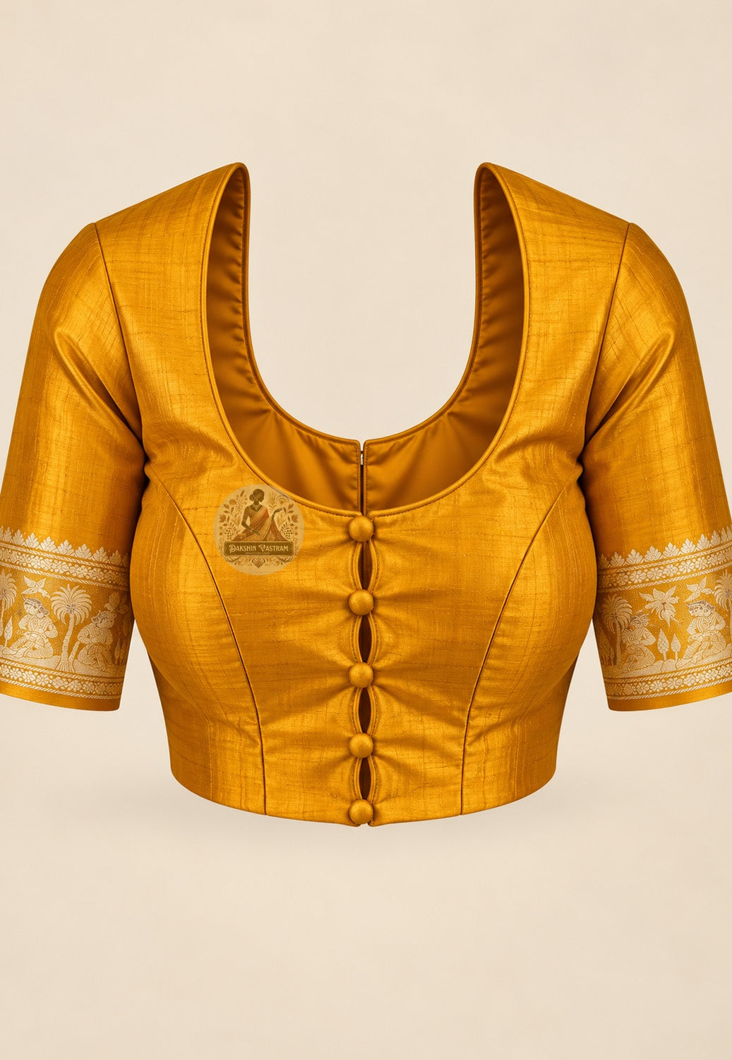 Blouse paired with mustard-gold Swarnachari silk saree in a matching shade with patterned sleeve borders