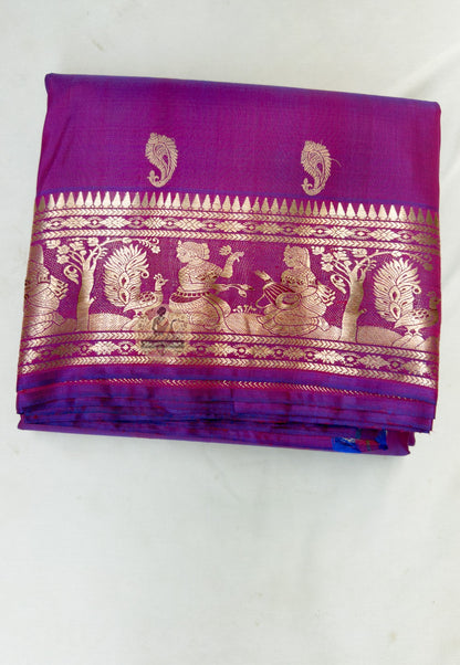 Close up of small scattered motifs on the magenta Swarnachari silk saree body