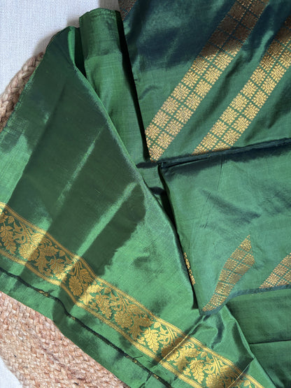 Close-up of scattered floral buti motifs woven into field of Paat Mekhela Chador authentic Sualkuchi Assam mulberry silk handloom