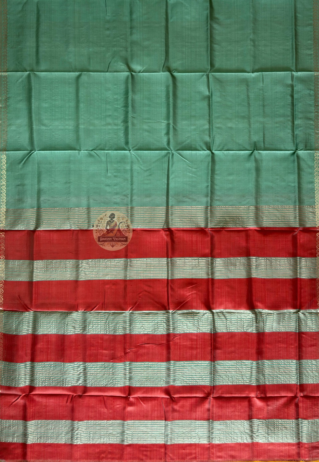Bishnupur silk saree flat lay showing complete six-yard length with decorative woven border and professionally finished fall and pico edges