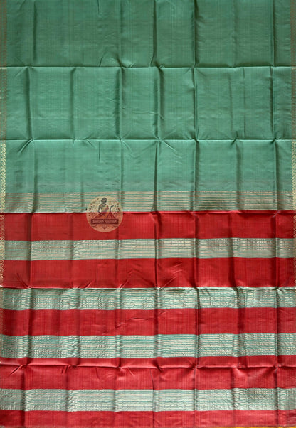 Bishnupur silk saree flat lay showing complete six-yard length with decorative woven border and professionally finished fall and pico edges