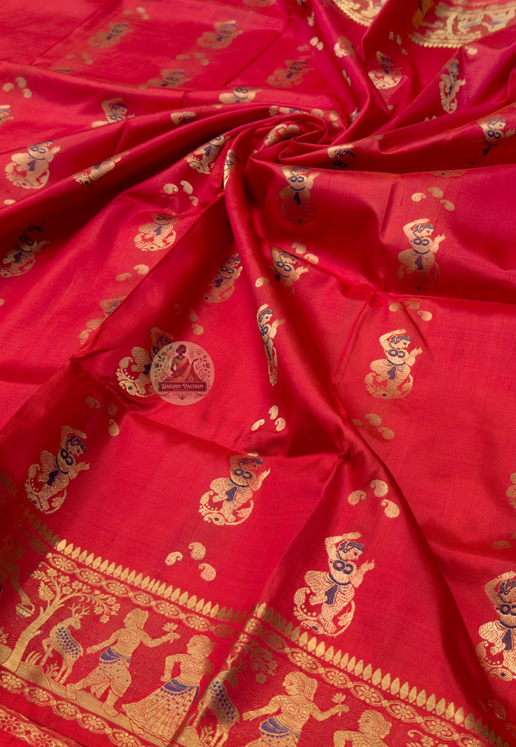 Rear view of Swarnachari silk saree displaying restrained golden zari pallu with hand-woven mythological and temple-art panels, Bengal handloom craft