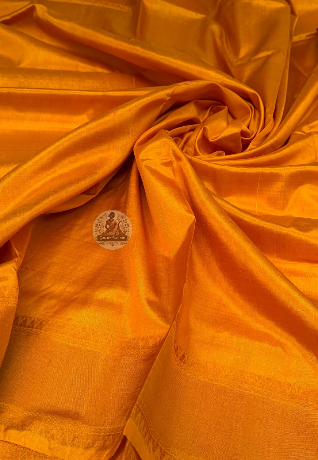 Close-up of handwoven zari border on Bishnupur Pure Katan Silk saree showing metallic thread detail