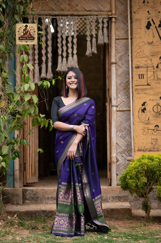 Close-up of handwoven Assam silk Mekhela Chador fabric with traditional motifs – authentic Assamese weave
