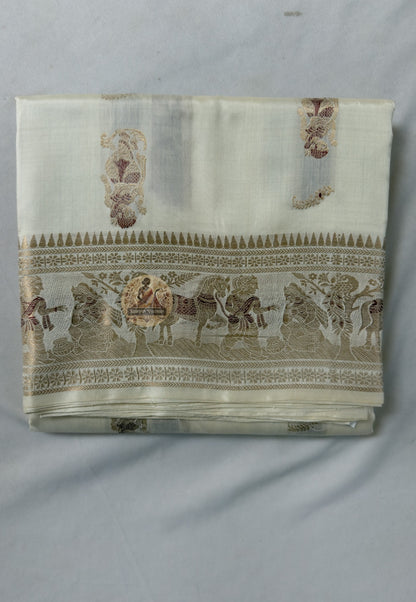 Close-up of pallu of white Swarnachari pure silk saree showing golden zari mythology and Bishnupur temple art compositions reading with precision and clarity on white silk ground