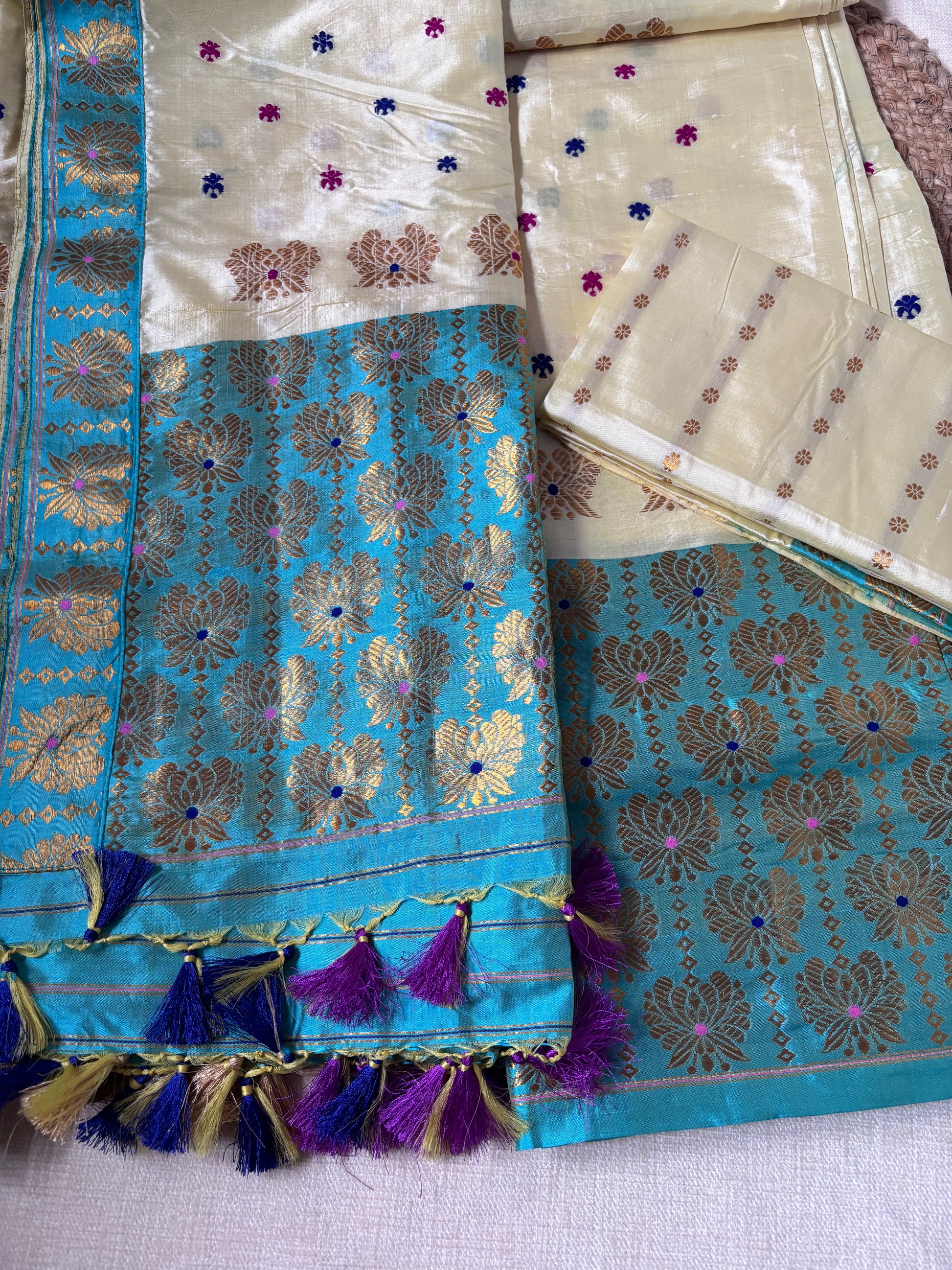Front view of woman wearing Paat Mekhela Chador with ivory silk blouse Diwali diaspora cultural gala collector authentic Sualkuchi Assam silk